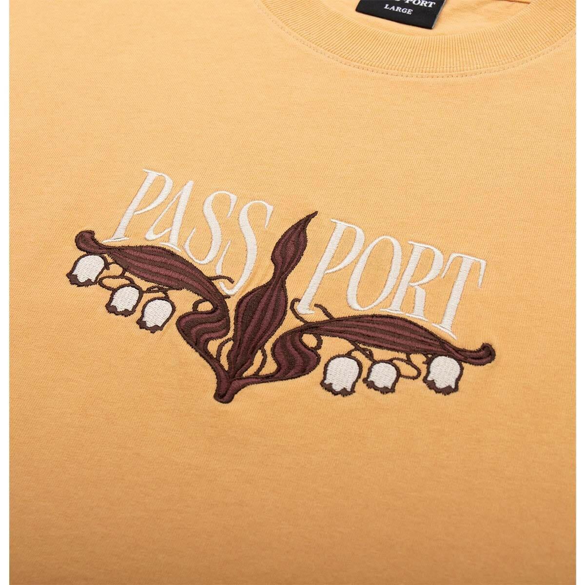 Pass~Port - Lily of The Valley Tee Barley.